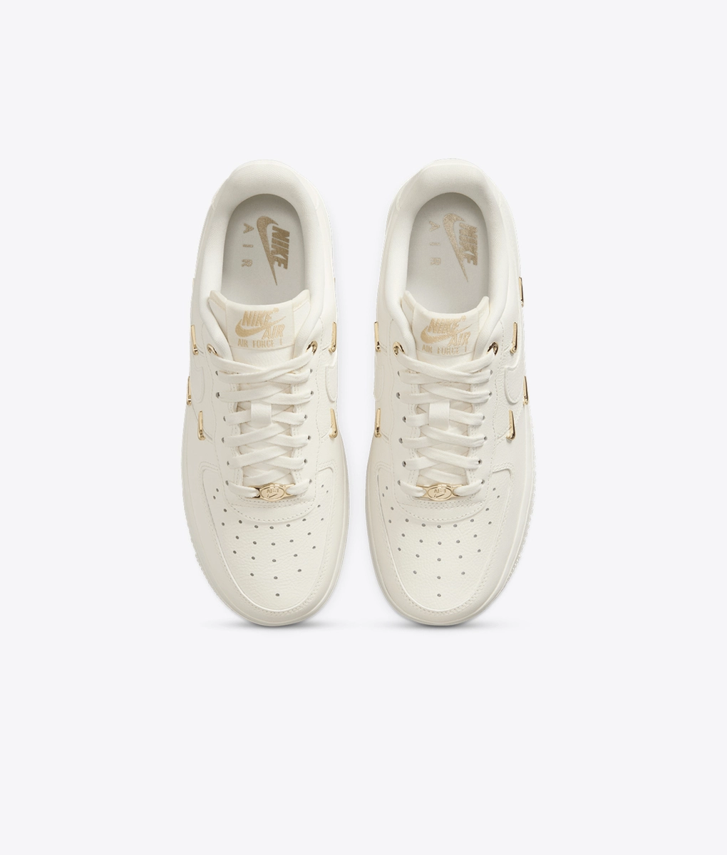 white nike with gold logo