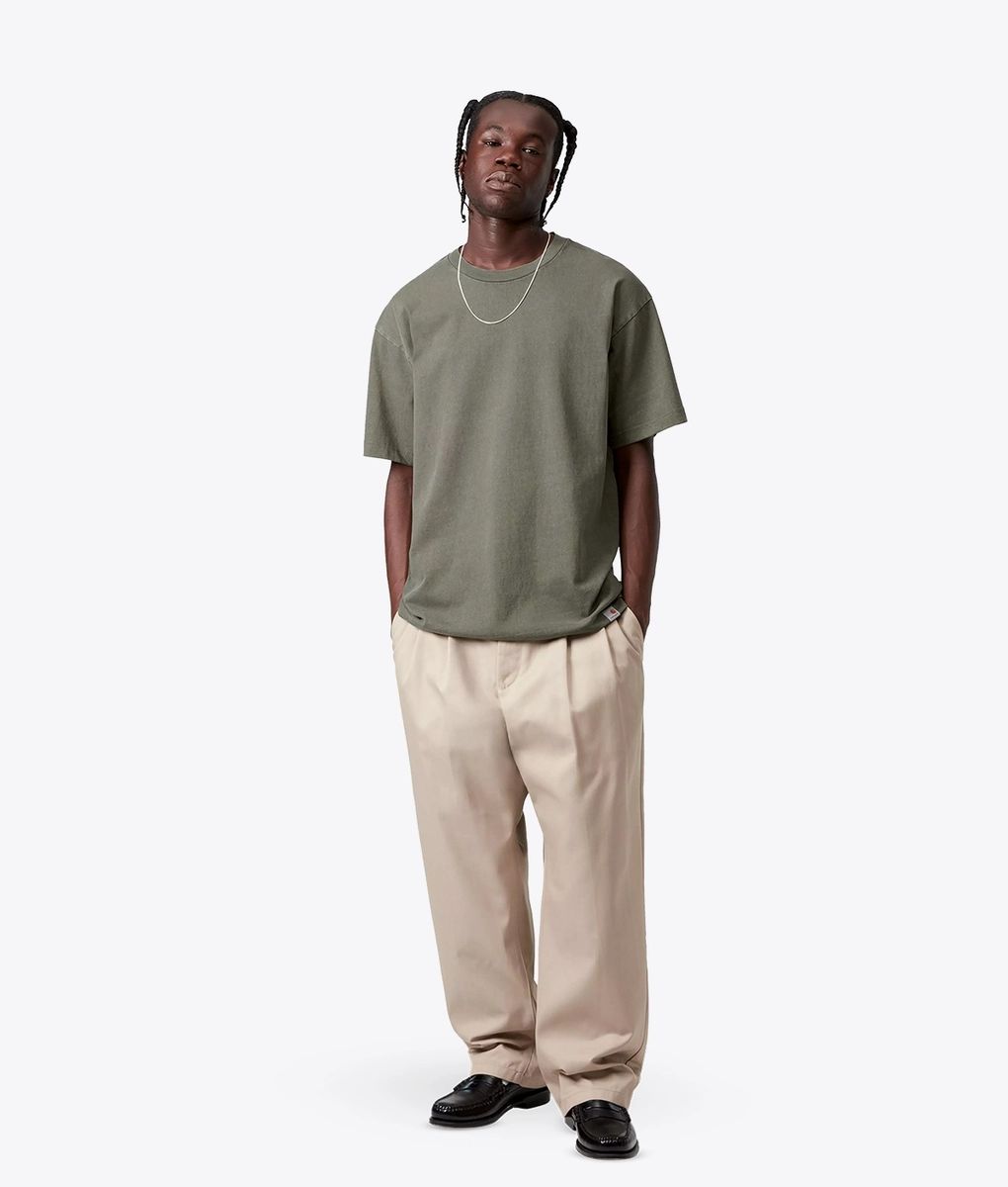 Olive garment-dyed T-shirt showing a softened, lived-in color finish