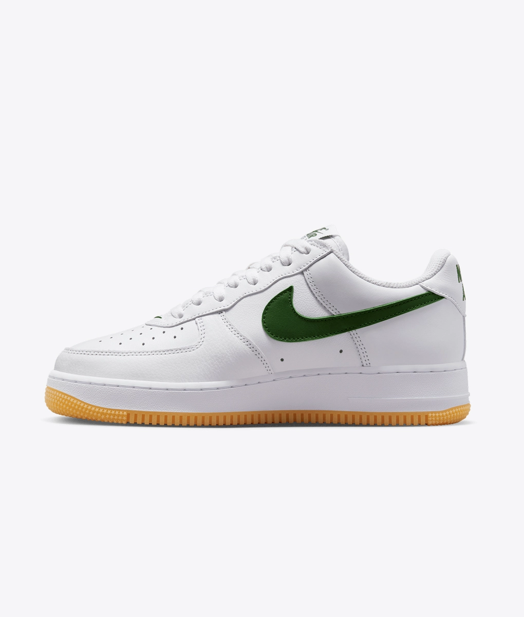 white nike air force with yellow tick