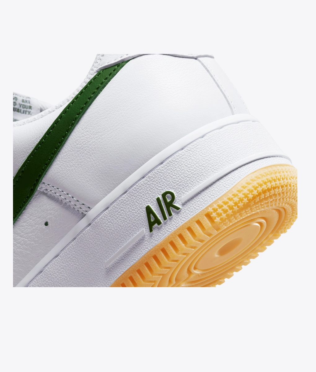 white and yellow air force 1 low