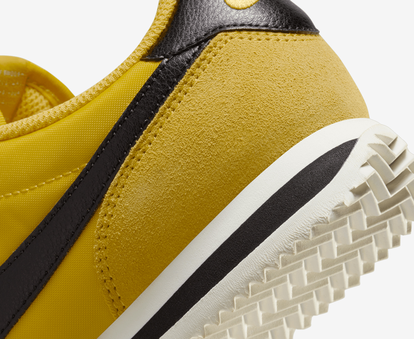 Black and yellow nike clearance cortez