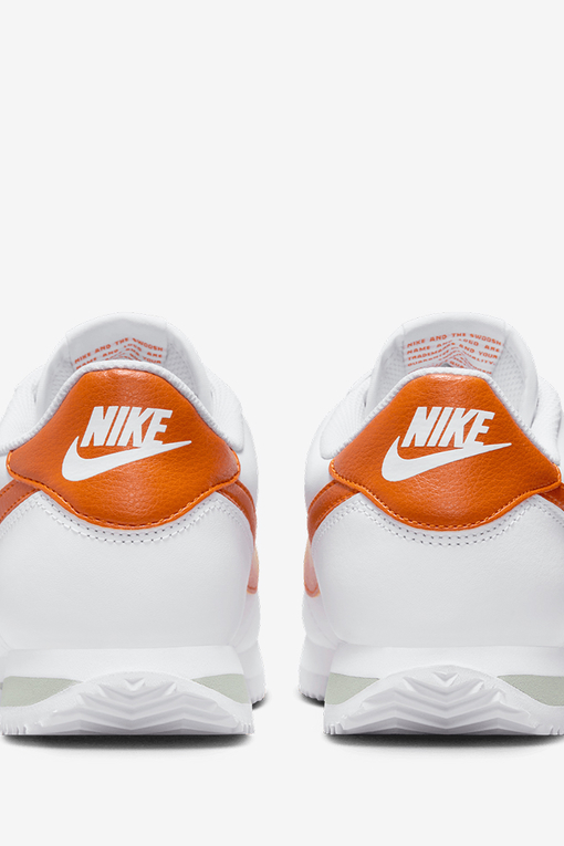 Orange and store white nike cortez