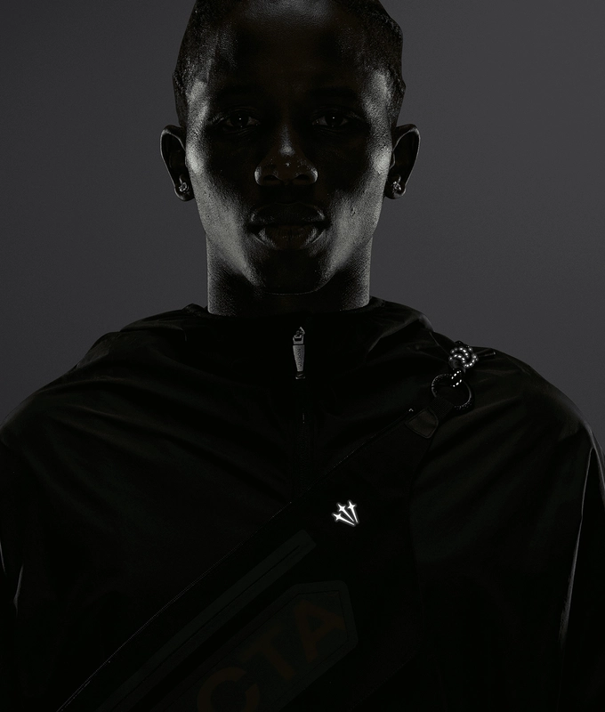 X NOCTA SHROUD CUT TRACK JACKET