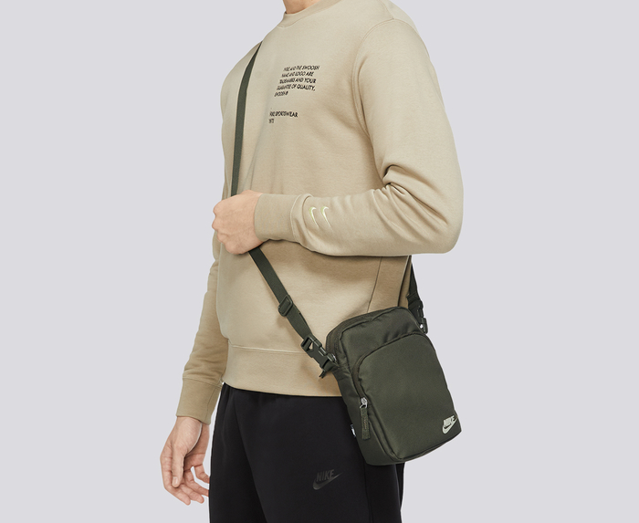 Buy the Nike Nike Heritage bum bag with iridescent logo in khaki on